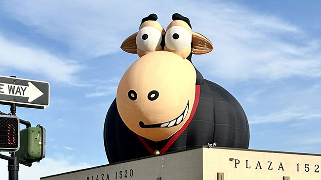 Other Balloon Peeking Over Building